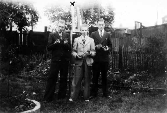 J. Broadbent, E. Burgess, M. Wade with rockets