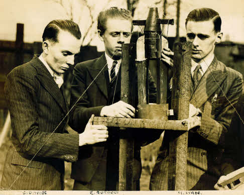 Stan Davies, Eric Burgess, M. Wade with rocket